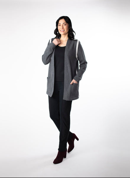 Charcoal Grey Fleece Cardigan with reverse fabric trim. Front pockets at hip. Styled with Black fitted tank and pants.