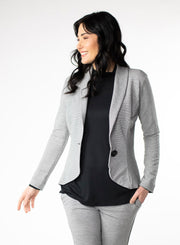 Grey and White stripe Tailored Blazer in Bamboo knit fabric with a wood button at front closure. Styled with black ribbed mock neck.