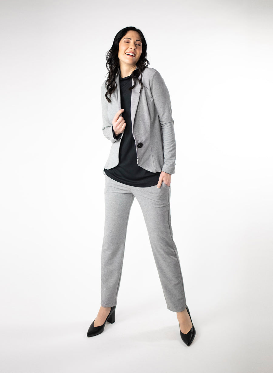 Grey and White stripe Tailored Blazer in Bamboo knit fabric with a wood button at front closure. Styled with black ribbed mock neck and grey striped pants