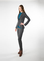 Charcoal Grey Tailored Blazer in Bamboo knit fabric with a wood button at front closure. Styled with Charcoal Grey pants and Blue ribbed mock neck.
