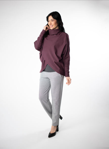 Plum fleece sweater with cowl neck and dolman cuffed sleeves. Sweater features a reverse-V drape in front.