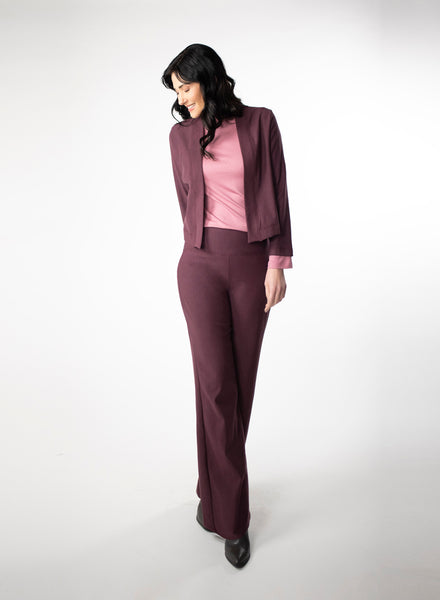 Plum Fleece wide leg pants. Wide waistband for support and coverage. Styled with a pink ribbed mock neck and matching fleece cropped cardigan. 