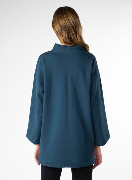Deep Blue Organic Cotton Fleece tunic length sweater with full sleeves. Features front pockets and wide collar. 