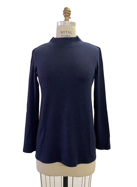 Navy mock neck fitting loose to the body with full length sleeves. Tencel Modal blend lux fabric