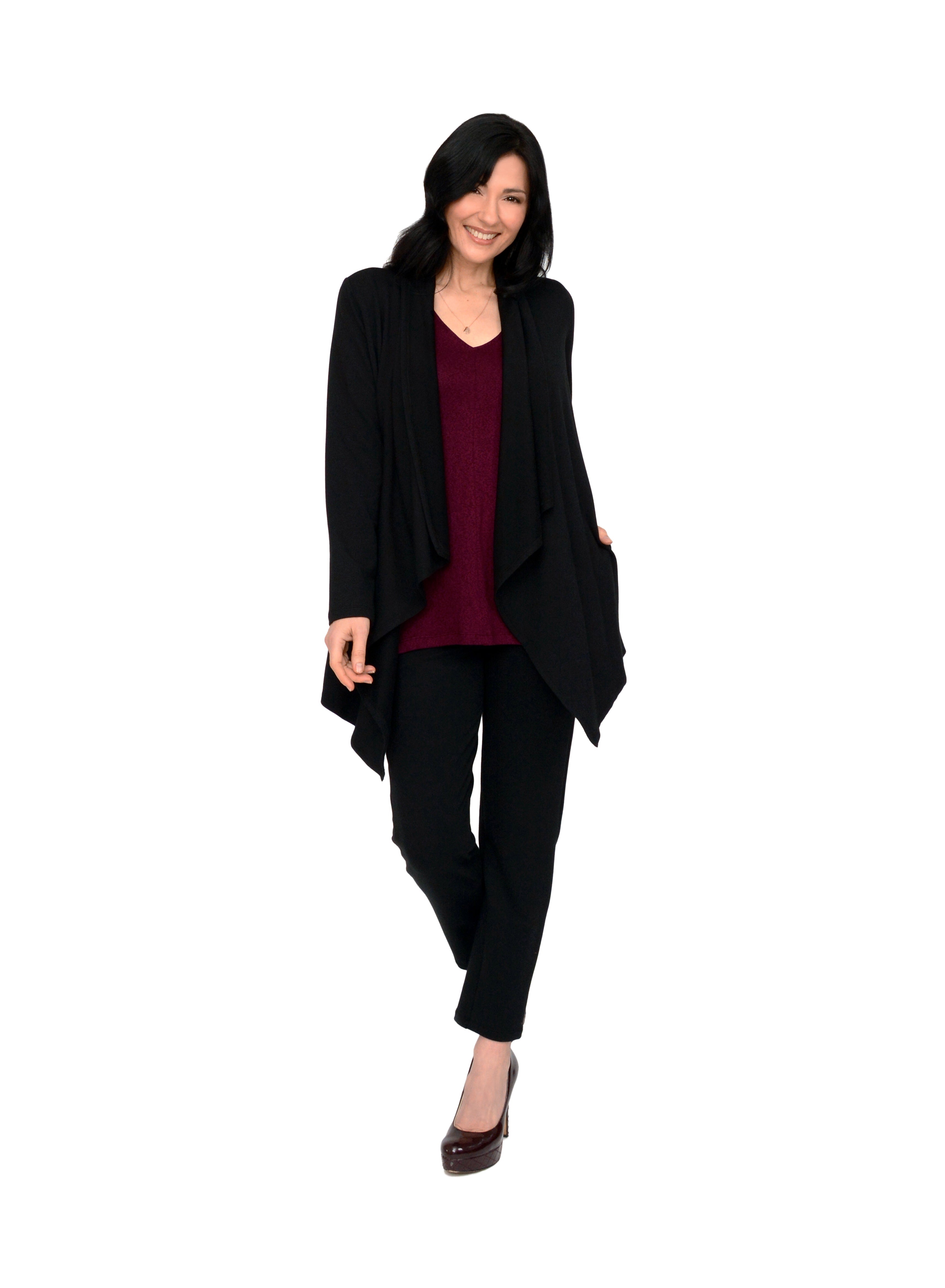 Black open style cardigan with long drape in front and side seam pockets. Styled with black pants