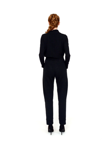 Black Organic Cotton unisex trouser. Reverse fabric waistband, pocket and cuff details. Styled with Black mock neck.
