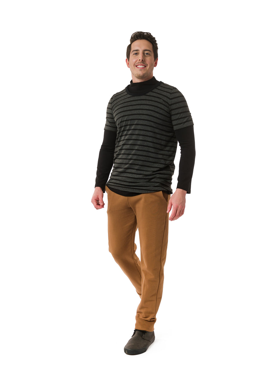 Black unisex mock neck, fitting close to the body with full length sleeves. Styled under Charcoal and Black unisex tee and Nutmeg unisex trousers.