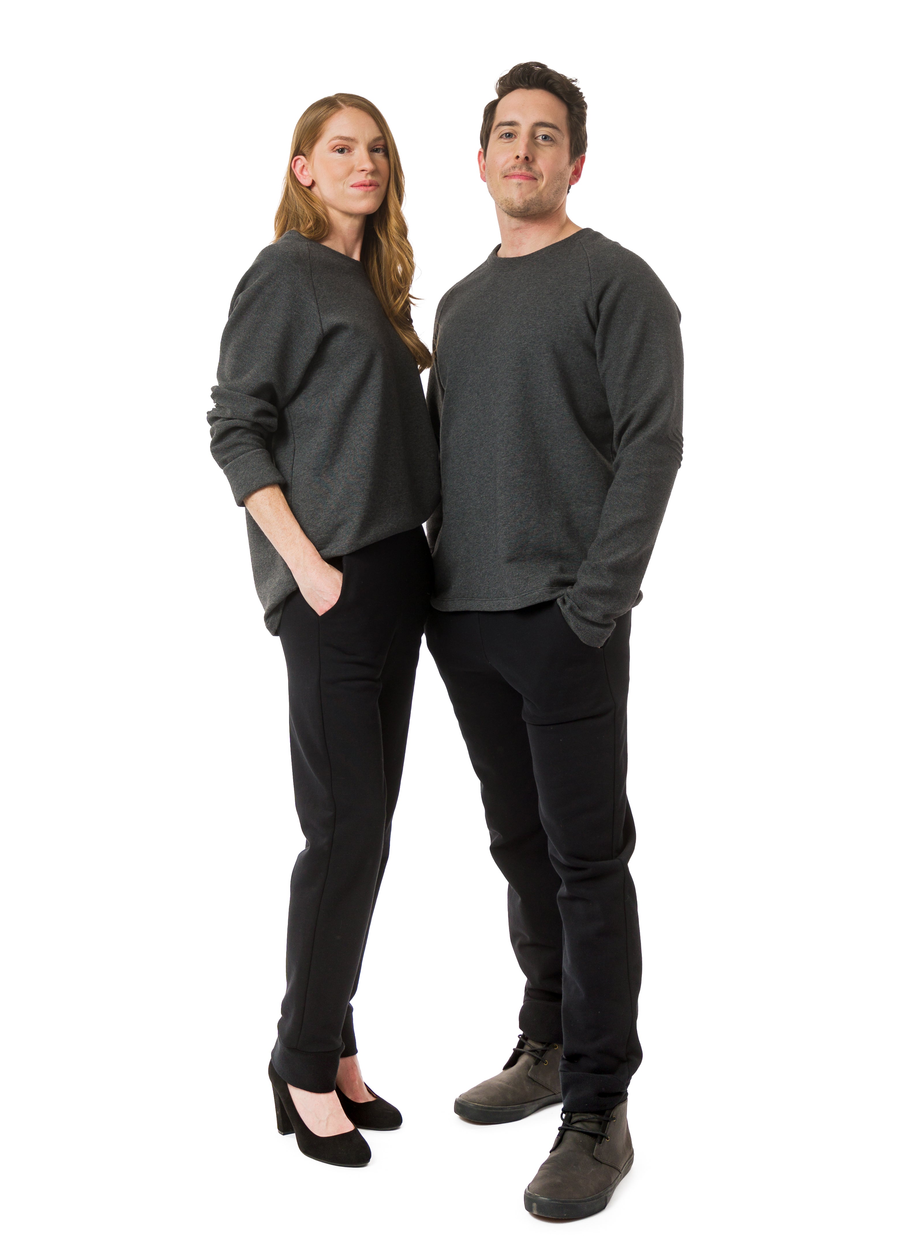 Charcoal Grey unisex sweater with reverse fabric sleeves and neck band. Pintuck detail on elbow. Styled with Black unisex trousers.