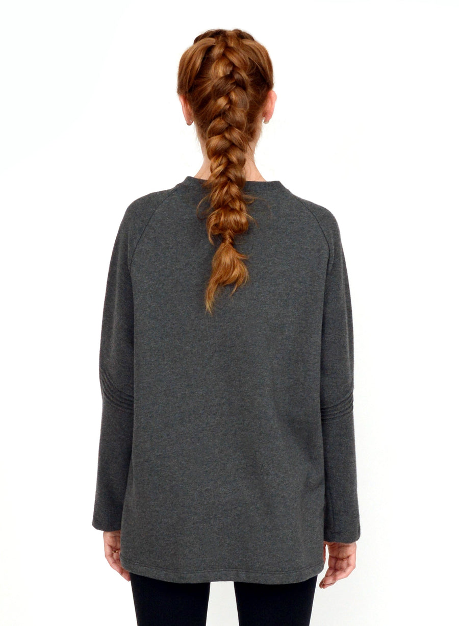 Charcoal Grey unisex sweater with reverse fabric sleeves and neck band. Pintuck detail on elbow.