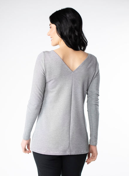Grey and white striped top with wrist length sleeve. 2-way neckline options. Showing V-neck in the back. 