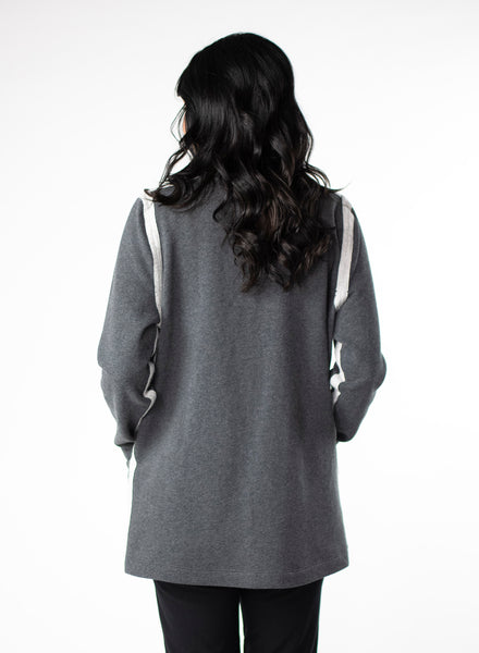 Charcoal Grey Fleece Cardigan with reverse fabric trim. Front pockets at hip. Styled with Black fitted pants.