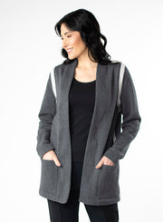 Charcoal Grey Fleece Cardigan with reverse fabric trim. Front pockets at hip. Styled with Black fitted tank and pants.