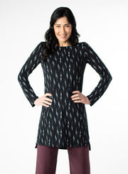 Black and White patterned tunic with step hem and boat neckline. Styled with Plum fleece wide leg pants. 