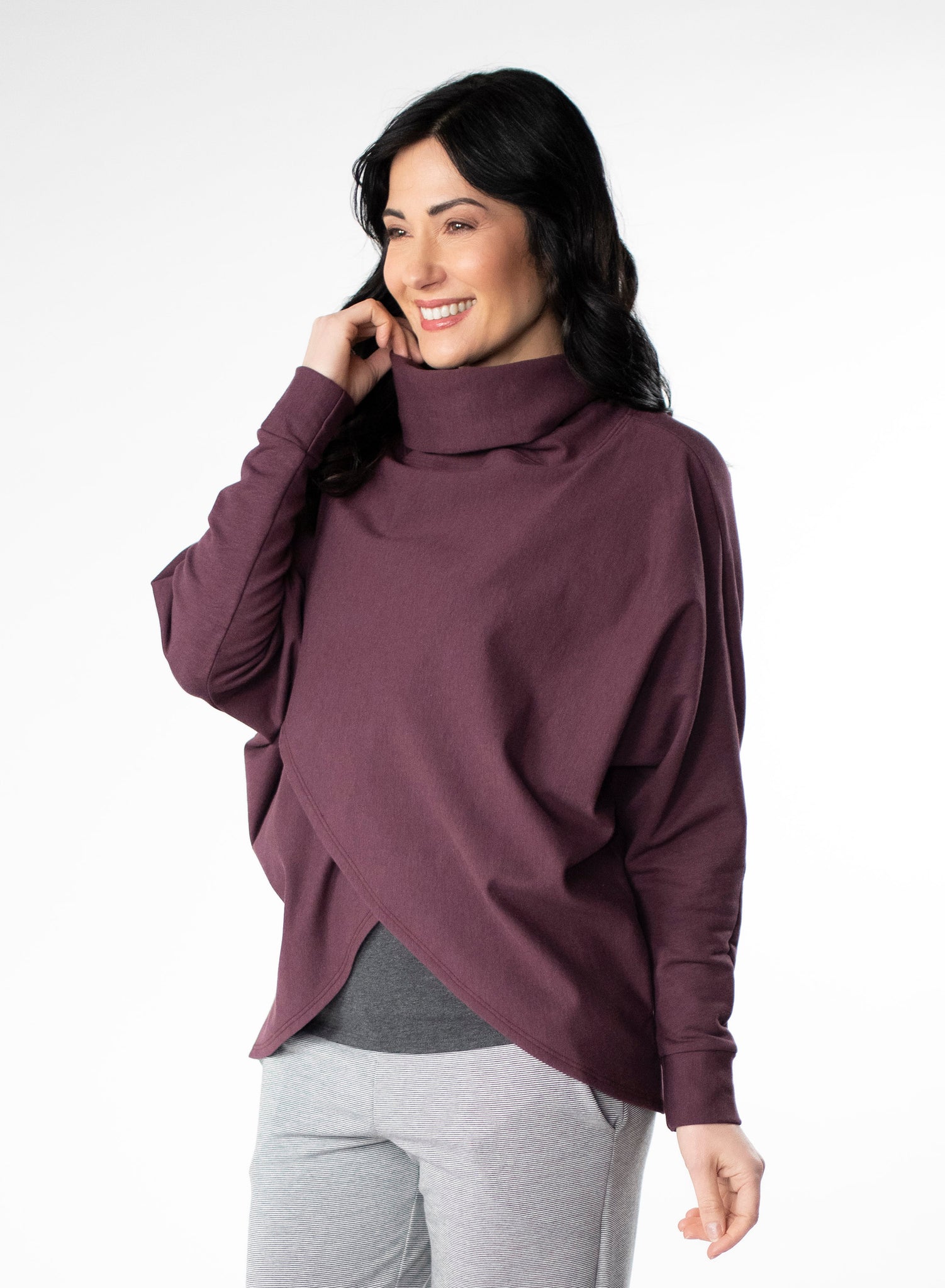 Plum fleece sweater with cowl neck and dolman cuffed sleeves. Sweater features a reverse-V drape in front.