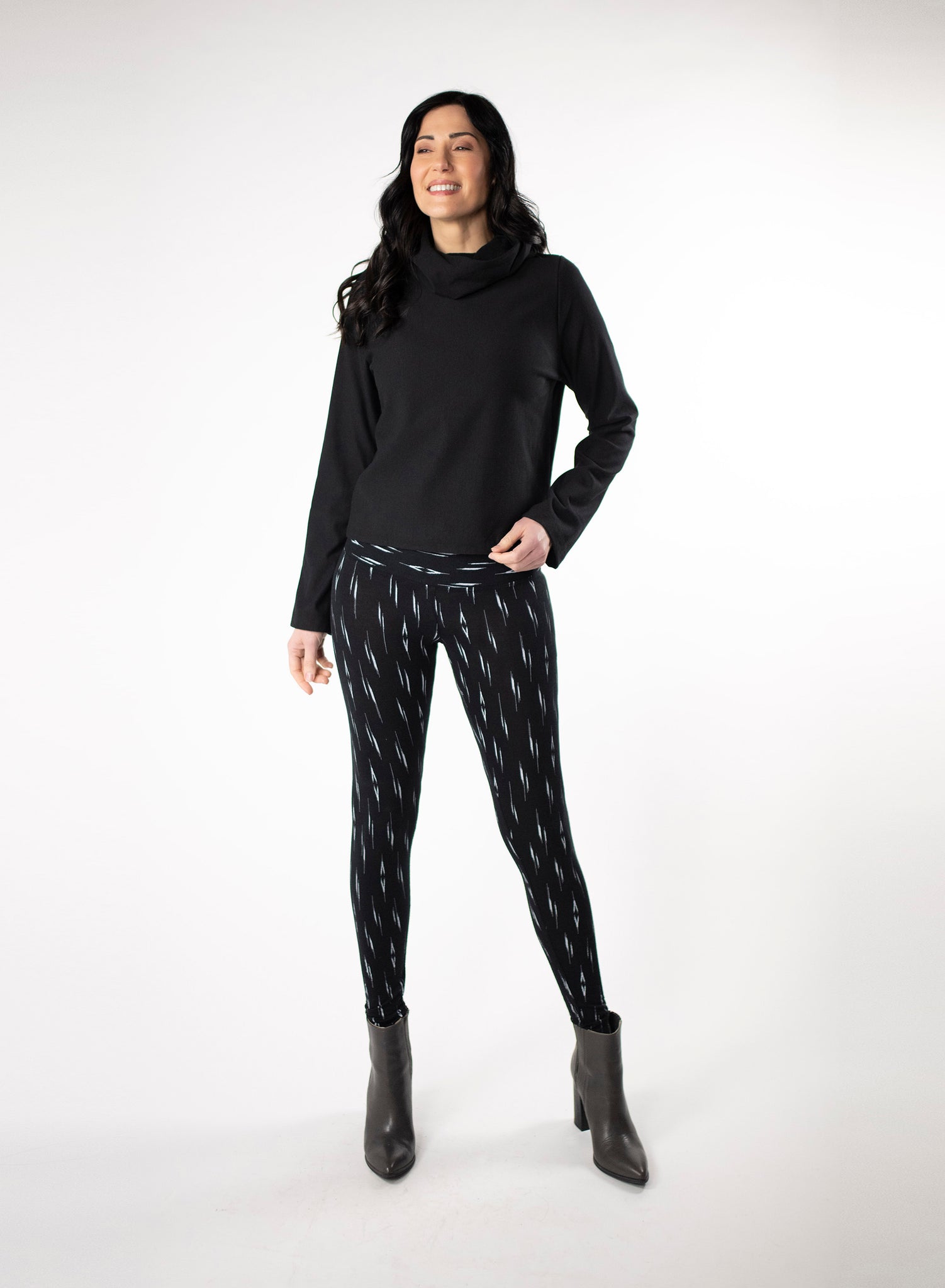 Black and White patterned bamboo leggings with a wide waistband. Styled with black cropped sweater
