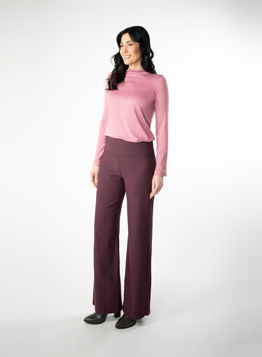 Plum Fleece wide leg pants. Wide waistband for support and coverage. Styled with a pink ribbed mock neck. Bamboo and Cotton Fleece fabric. 