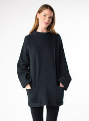 Black Organic Cotton Fleece tunic length sweater with full sleeves. Features front pockets and wide collar. 