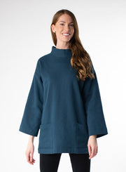 Deep Blue Organic Cotton Fleece tunic length sweater with full sleeves. Features front pockets and wide collar. 