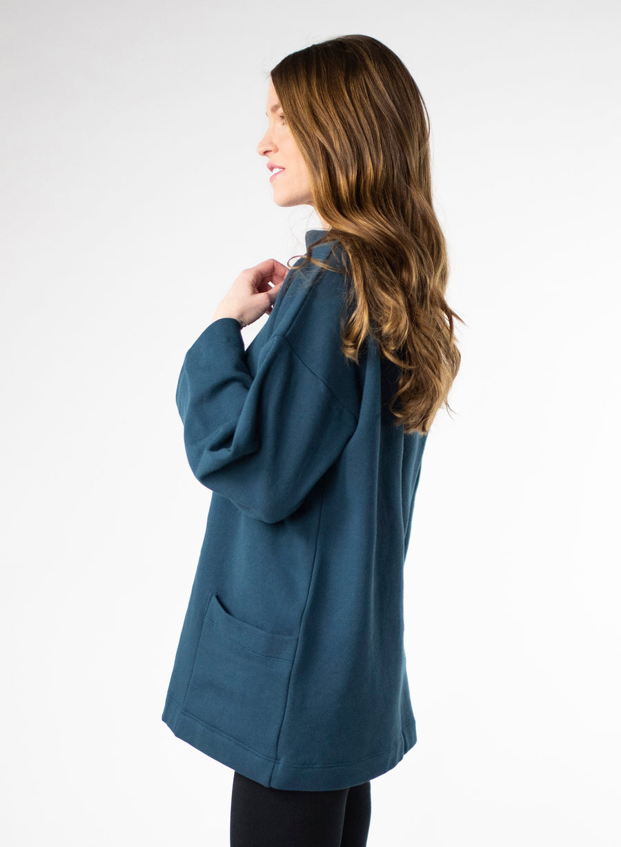 Deep Blue Organic Cotton Fleece tunic length sweater with full sleeves. Features front pockets and wide collar. 