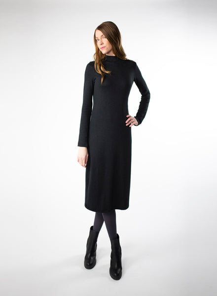 Black mock neck dress with full length sleeves. Dress length ends below the knee. Styled with Charcoal Grey leggings. Tencel Modal blend lux fabric.