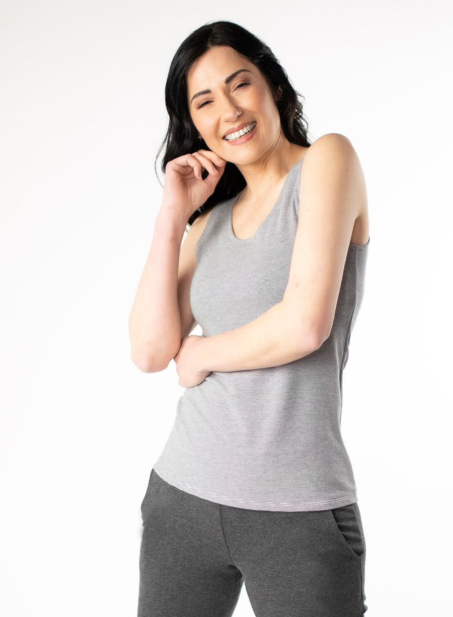 Grey and white striped fitted scoop neck tank top. Styled with Charcoal Grey cuffed pants.