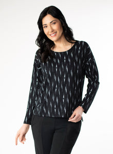 Black and White patterned long sleeve top with scoop neck and relaxed fit to the body. Step hem with a small side slit.