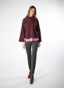 Charcoal Grey fitted cigarette style pant. Ankle length pant with pockets and wide waistband. Styled with Plum waffle knit cropped sweater. 