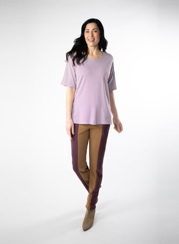 Burgundy and White striped oversize tee with mid bicep length sleeve and split at side seam. Styled with Plum and Nutmeg pants.