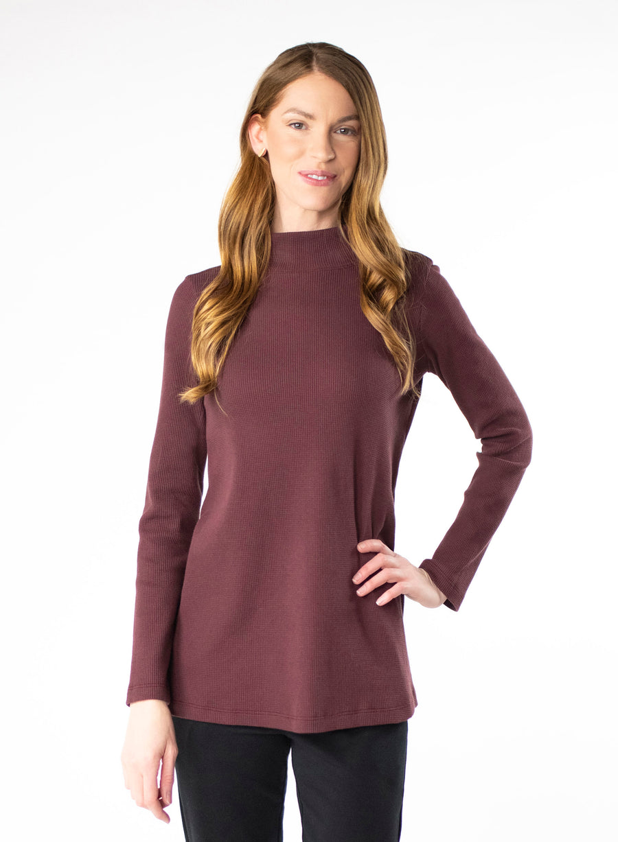 Plum organic cotton waffle knit mock neck. Loose fit to the body.