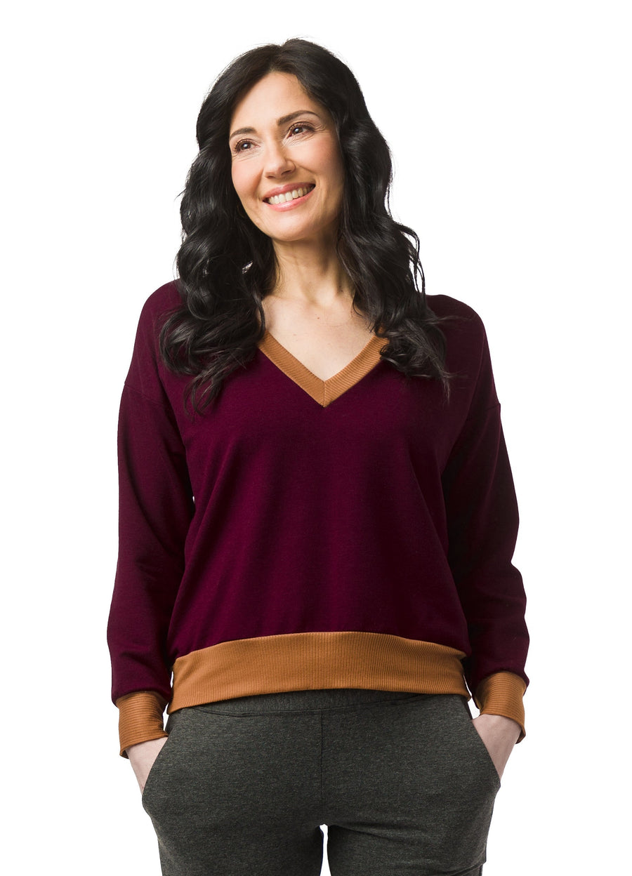 Burgundy V-neck sweater with Caramel rib accent details on neck band, cuff and hem.