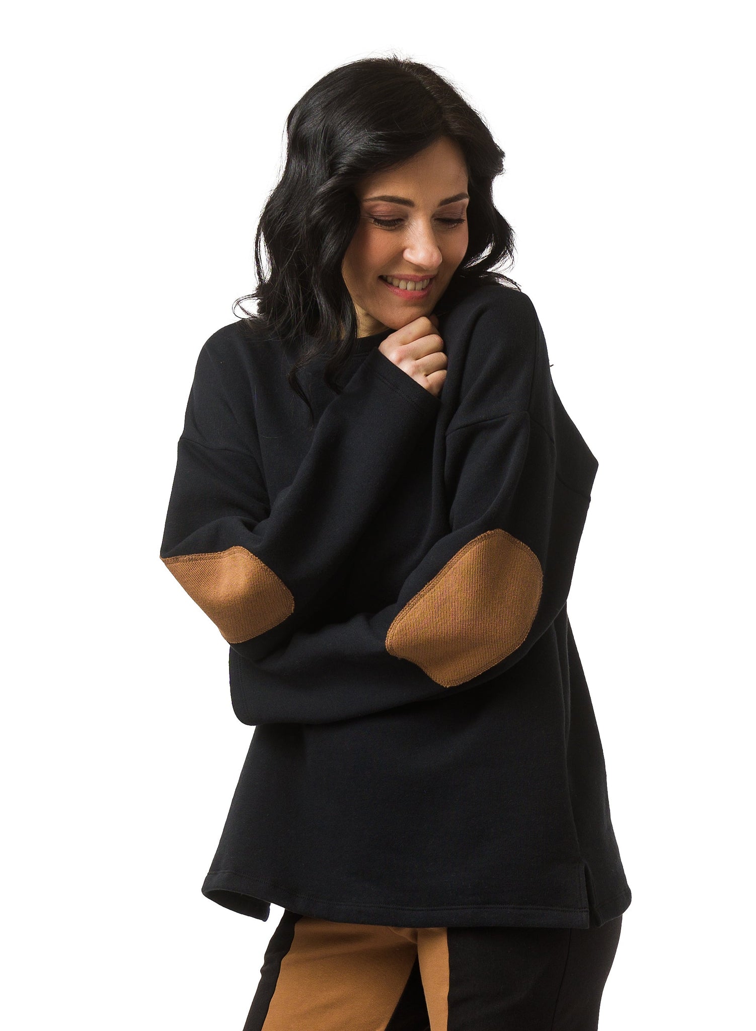 Black Organic Cotton Fleece unisex sweater. Features Nutmeg elbow patch in twill fabric. 