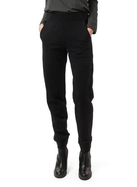 Black Organic Cotton unisex trouser. Reverse fabric waistband, pocket and cuff details. Styled with Charcoal Grey mock neck.