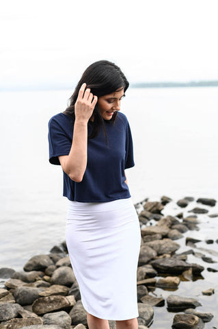 The Travelers Skirt is a white, H-line skirt made from sustainable, eco-friendly fabrics.