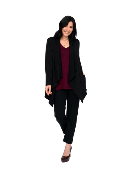 Black open style cardigan with long drape in front and side seam pockets. Styled with black pants