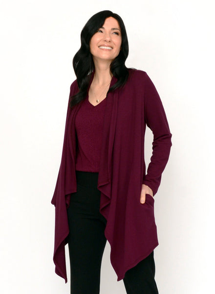 Burgundy open style cardigan with long drape in front and side seam pockets.