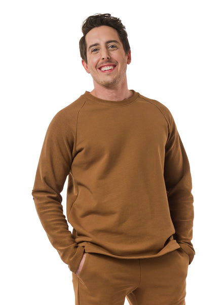 Nutmeg unisex sweater with reverse fabric sleeves and neck band. Pintuck detail on elbow.